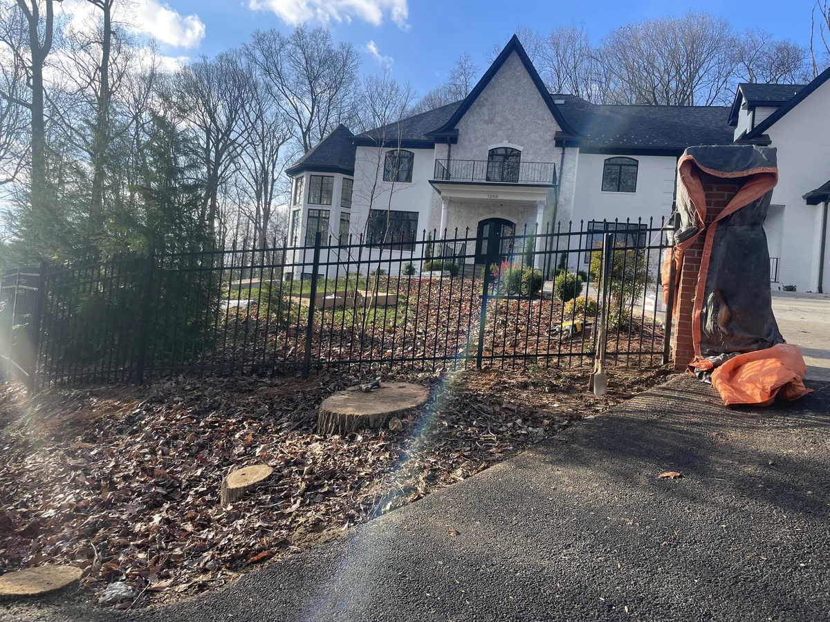 Colonial aluminum fence with finials at an estate entry, under Our Fencing Projects