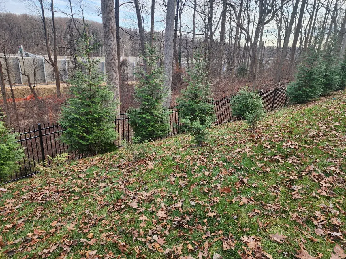 Colonial-style black aluminum fence with staggered finials, under Our Fencing Projects