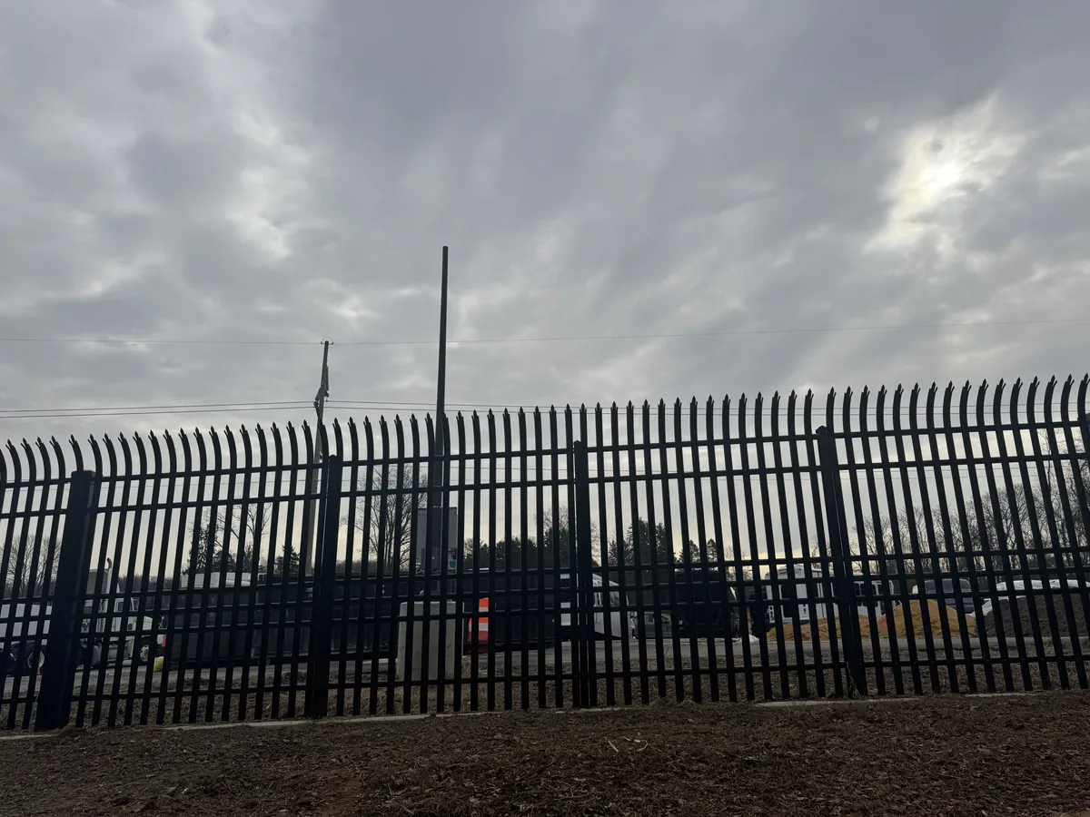 Security fence enclosing a commercial building in Northern Virginia, under Our Fencing Projects