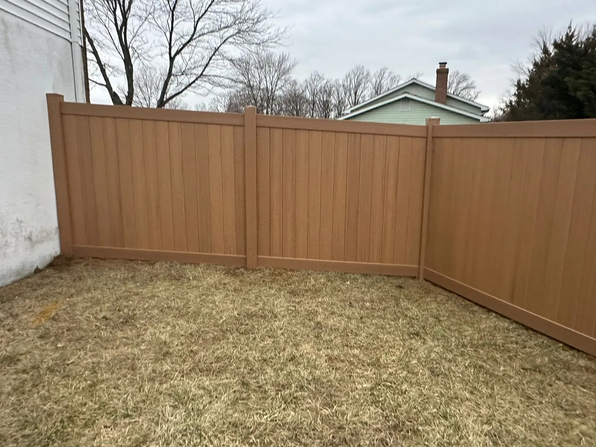 Cypress-toned vinyl privacy fence run, under Our Fencing Projects