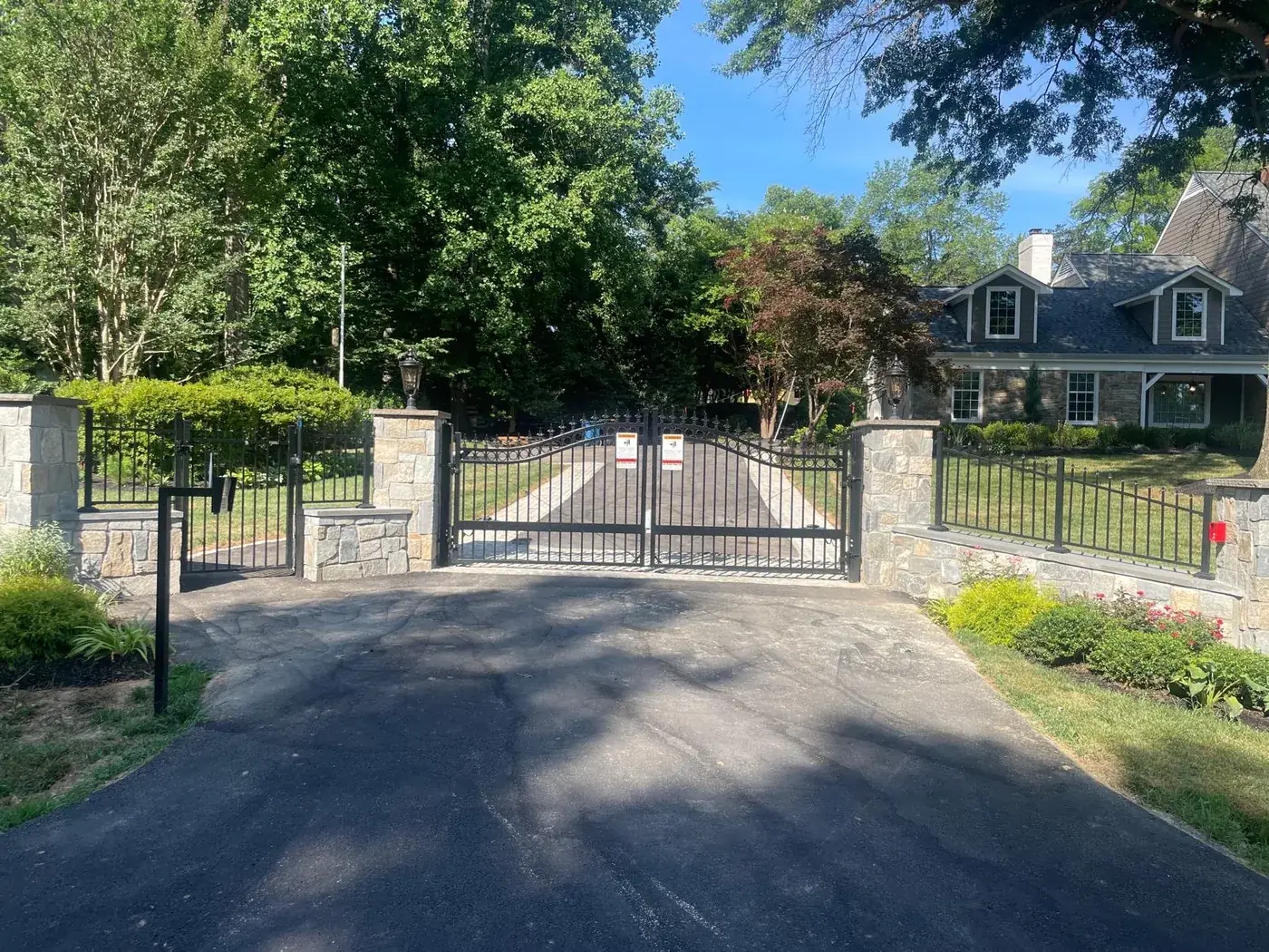The estate standard — paired leaves between piers or posts., under Automatic Gate Installation & Repair