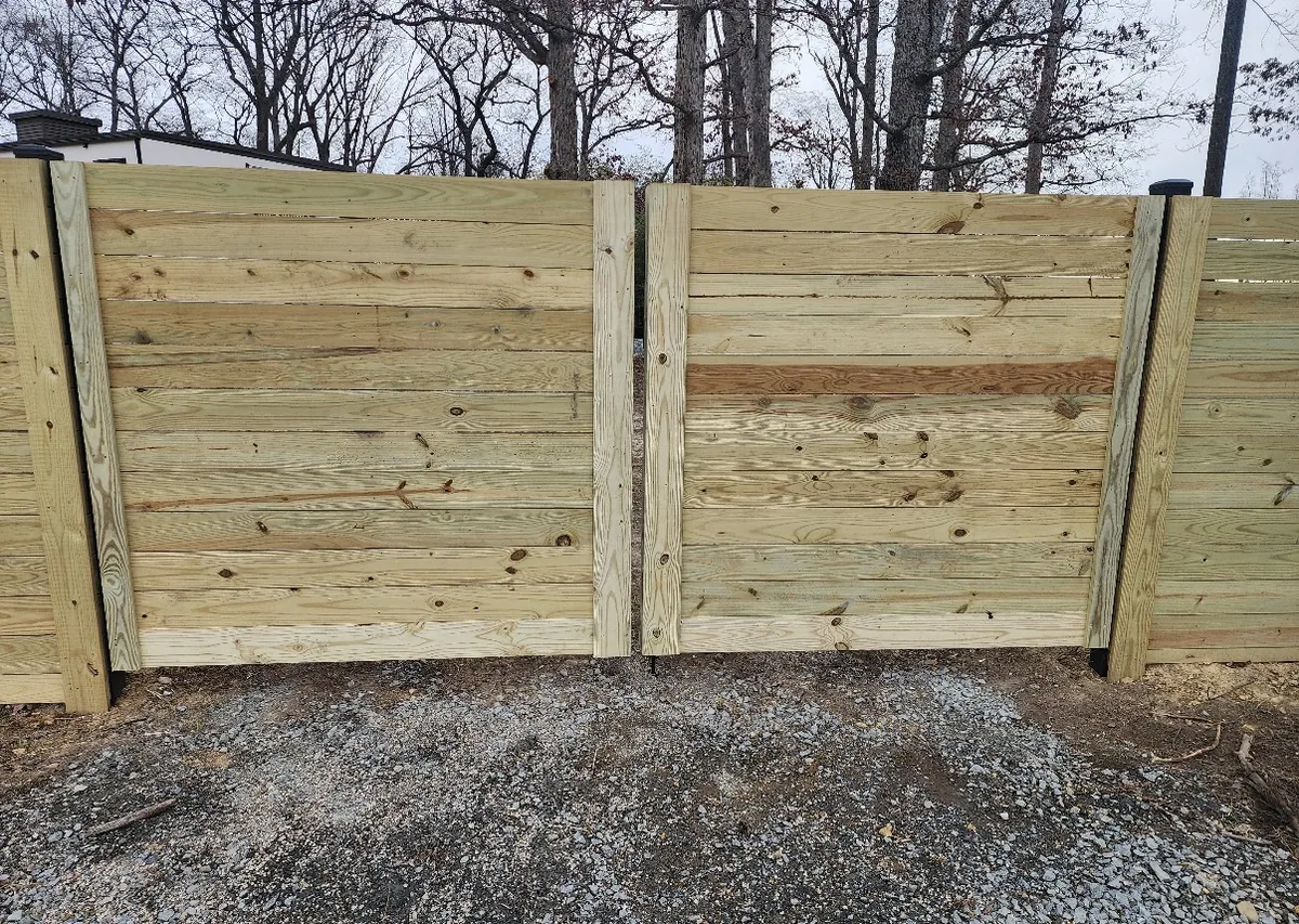 Automatic gate with picket infill panels, under Our Fencing Projects