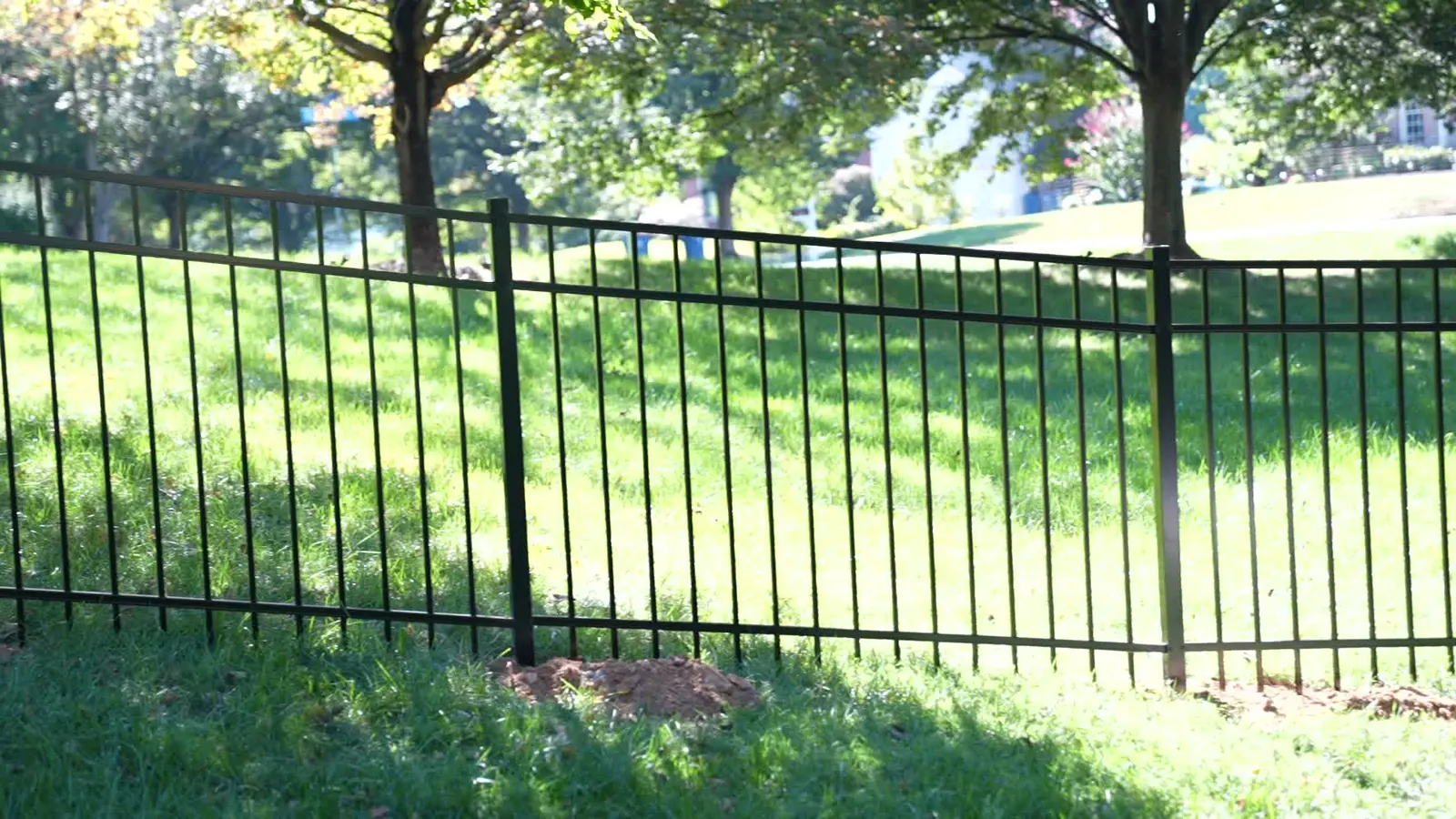 Black aluminum fence along a lawn in Northern Virginia, under Our Fencing Projects