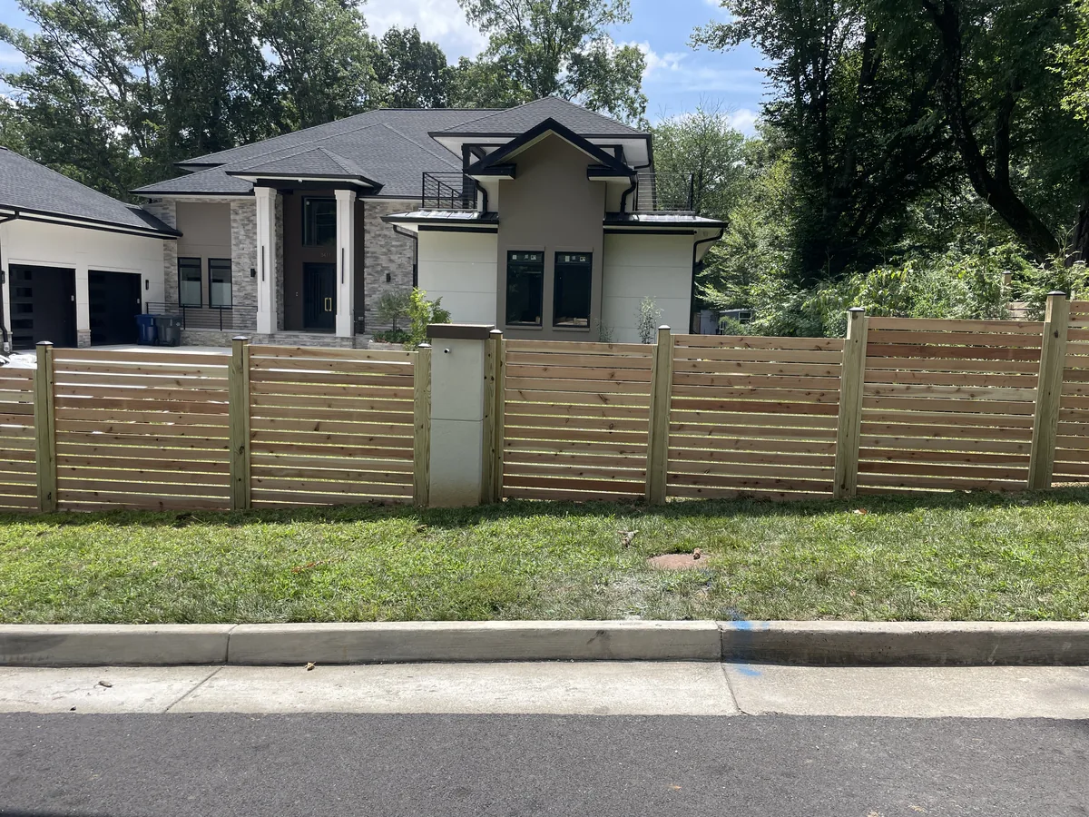 Horizontal cedar fence with spaced 1x4 boards, under Our Fencing Projects