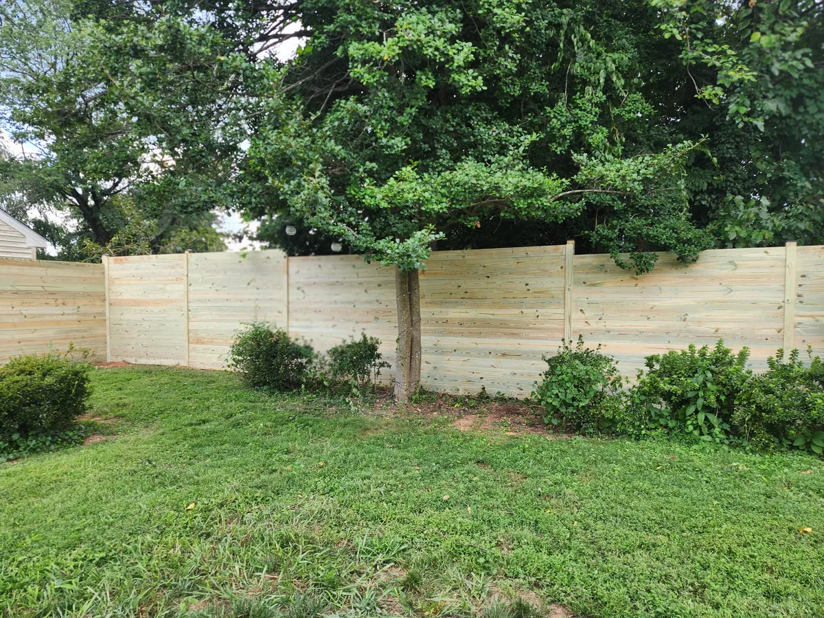Horizontal pressure-treated privacy fence, under Our Fencing Projects