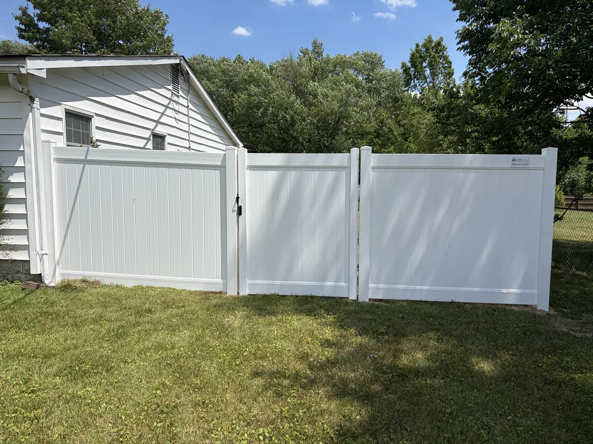 Nexus-style vinyl fence with gate, under Our Fencing Projects