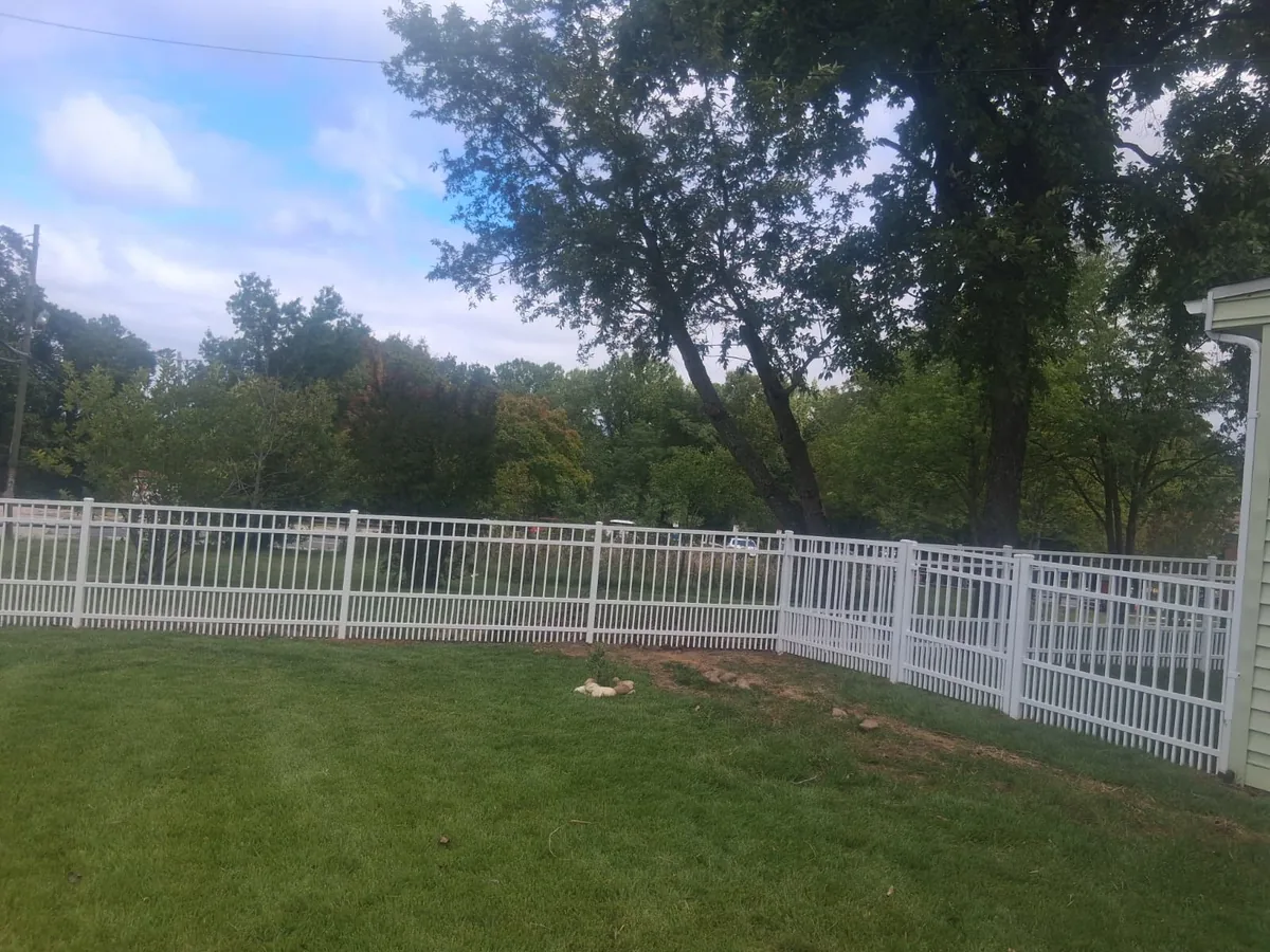 White aluminum puppy picket fence with close picket spacing, under Our Fencing Projects