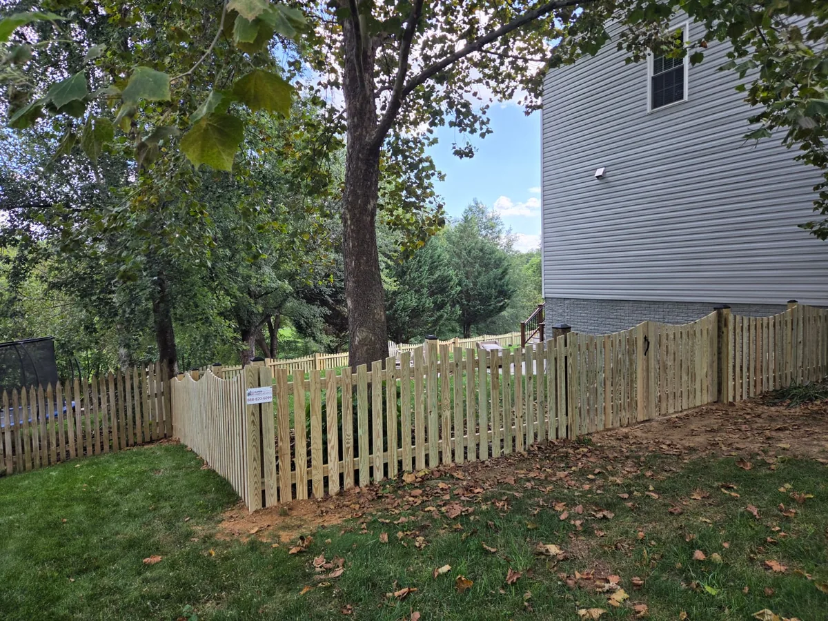 Scalloped wood picket fence at a front walk, under Our Fencing Projects