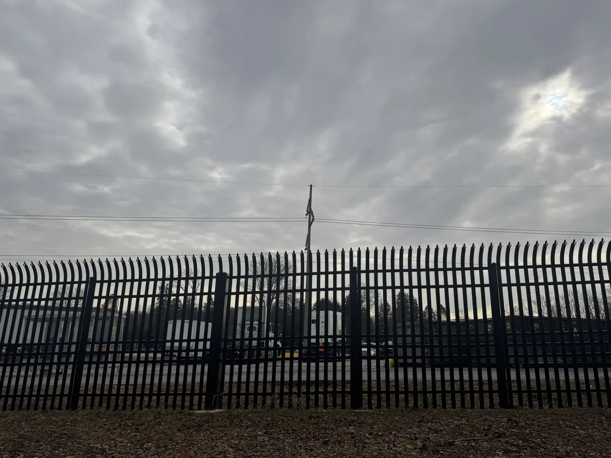 Security fence turning a commercial lot corner, under Our Fencing Projects