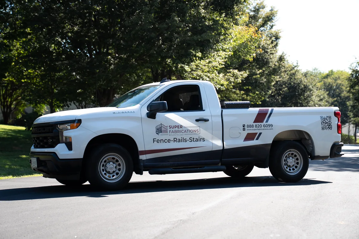 Super Fabrications truck door with company logo, under Our Fencing Projects