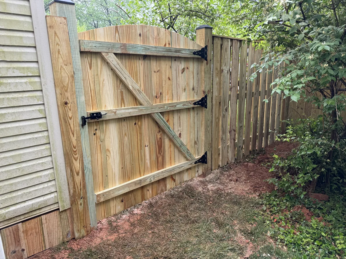 Wood shadowbox fence in afternoon sun, under Our Fencing Projects