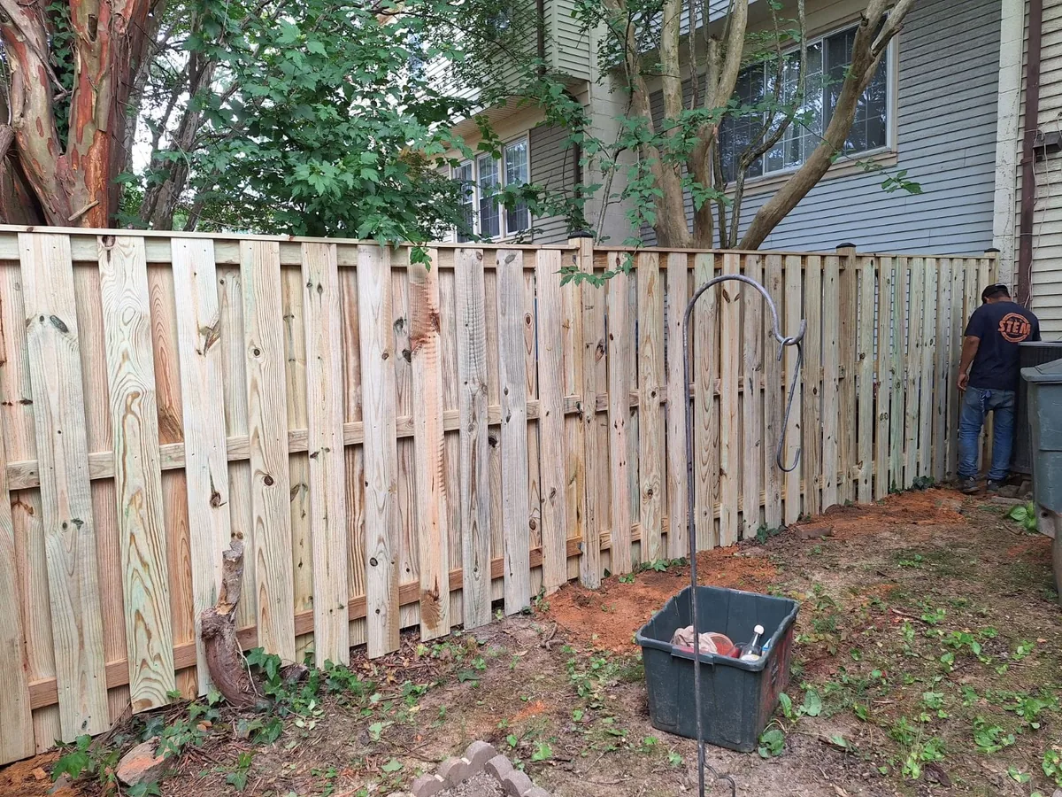 Wood shadowbox fence beside a Northern Virginia townhouse, under Our Fencing Projects