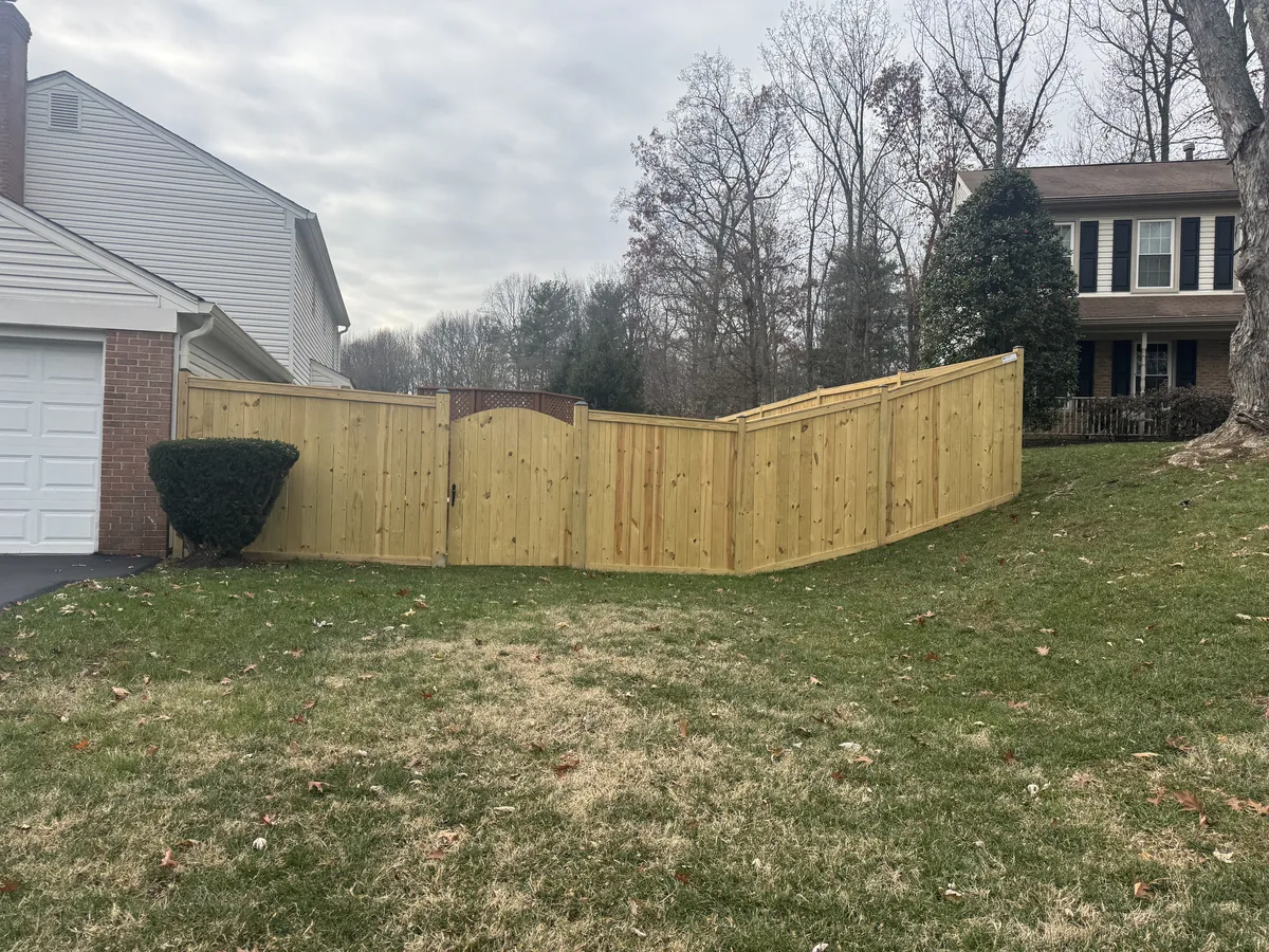 Stockade fence with cap and trim detail, under Our Fencing Projects