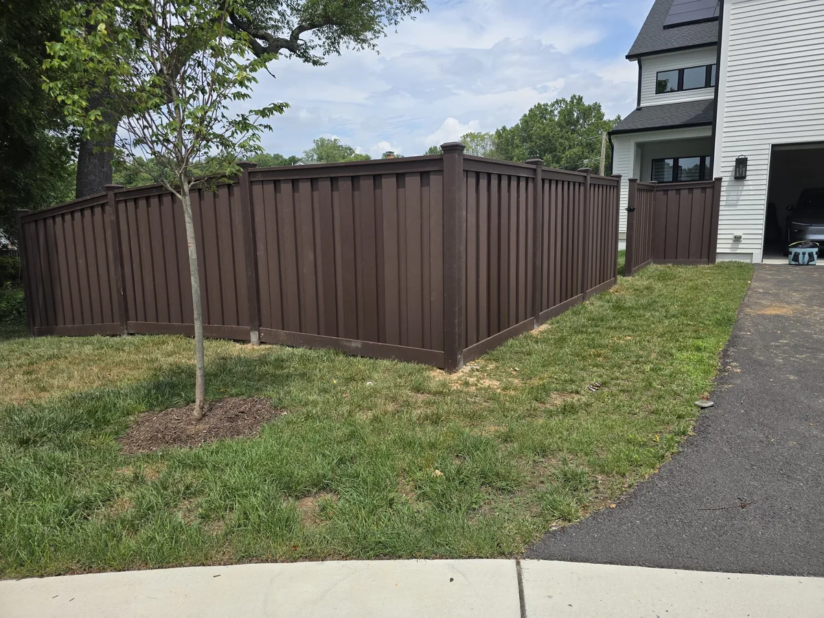 Trex composite privacy fence turning a corner beside a driveway, under Our Fencing Projects