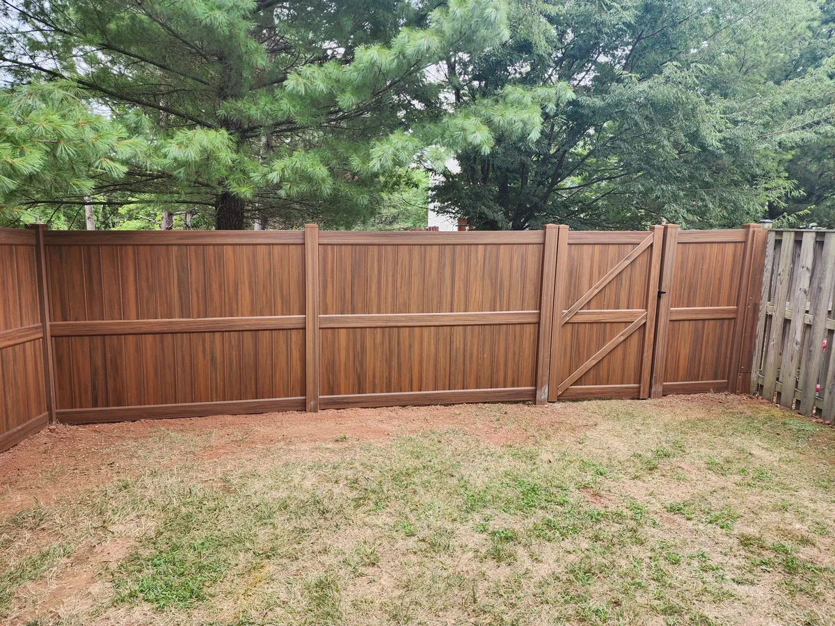 Mocha vinyl privacy fence in an HOA neighborhood, under Our Fencing Projects