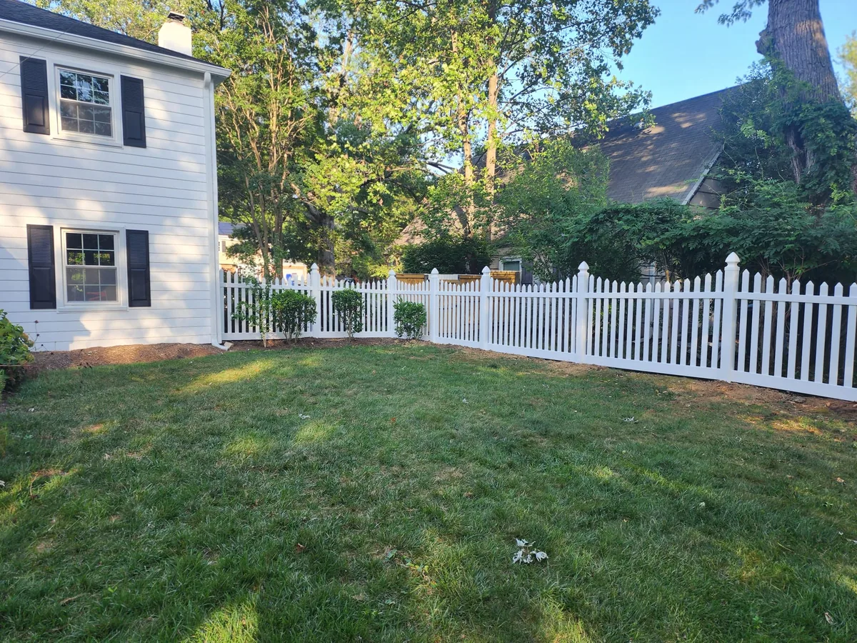 White vinyl scalloped picket fence line, under Our Fencing Projects