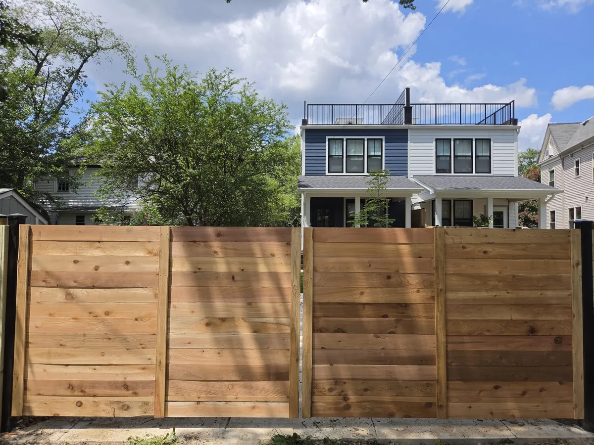 Wood gate with automatic operator hardware, under Our Fencing Projects