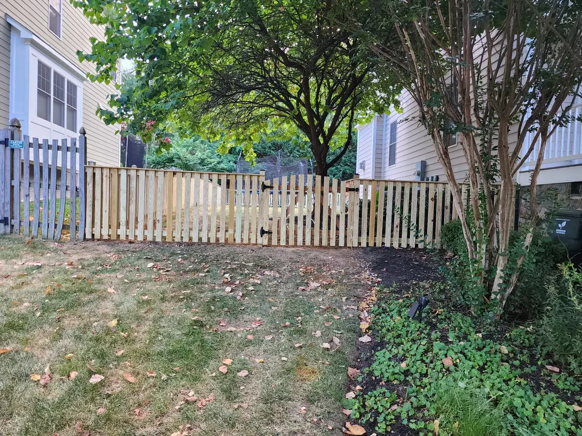 Wood spaced picket fence along a garden path, under Our Fencing Projects
